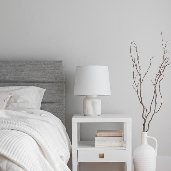 Hara 1 Drawer Accent Table in White Beside Bed