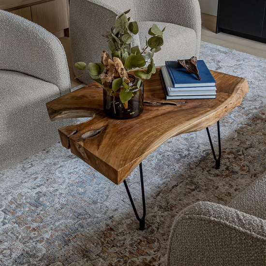 Natura Hairpin Coffee Table styled between modern lounge chairs